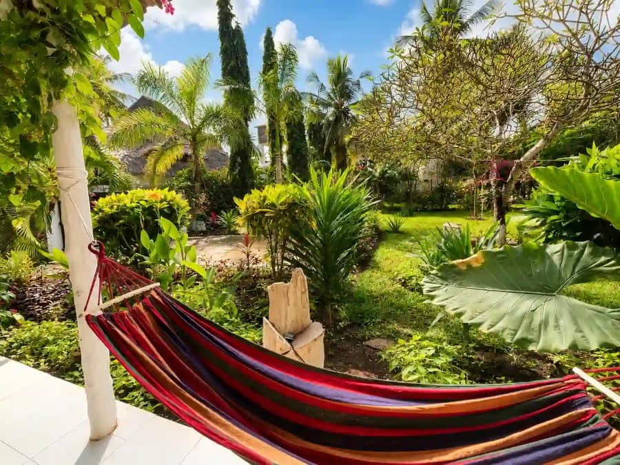 Colourful hammock in the lush tropical garden at Cali Blossom Villa